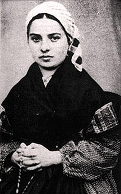 A photo of Saint Bernadette holding a Rosary.